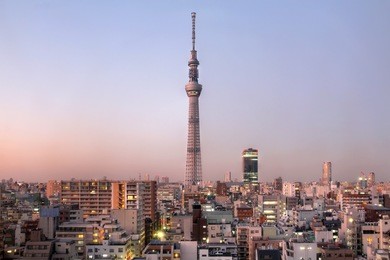 tokyo skyline with tokyo sky tree (634m), the highest free-standing structure in japan and 2nd in the world at sunset in december 2011.