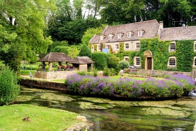 picturesque garden in the cotswold village of bibury, england