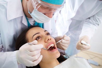dentist and his assistant carrying out a thorough examination