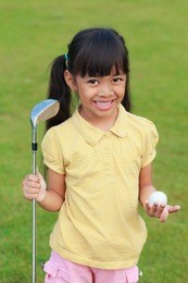 smiling little girl at golf club