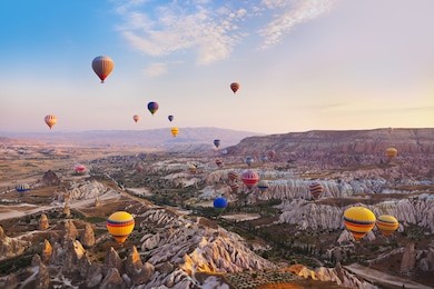 hot air balloon flying over rock landscape at cappadocia turkey