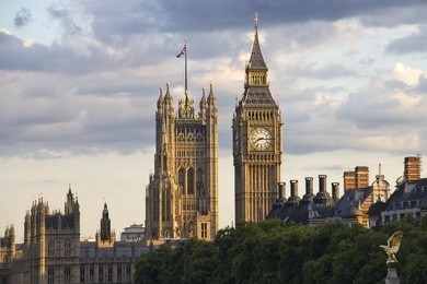 big ben and westminster parliament in the evening sun in london, uk