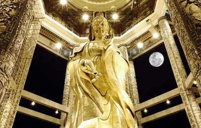 night view of the bronze statue of the buddhist goddess of mercy known as kuan yin in kek lok si buddhist temple complex in air itam, penang, malaysia.