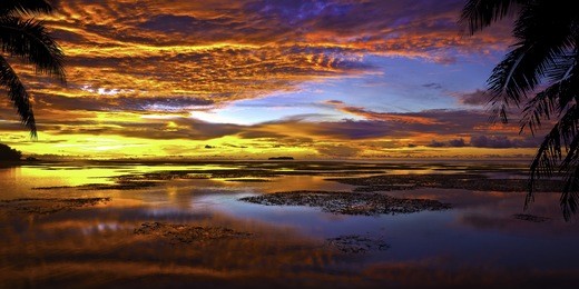 tropical sunset and reflection over managaha island, sailpan c.n.m.i..