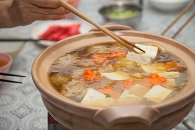 eating japanese winter hot soup - nabe