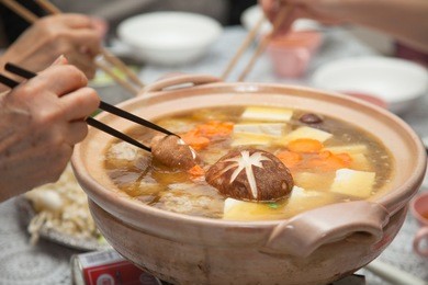 eating japanese winter hot soup - nabe