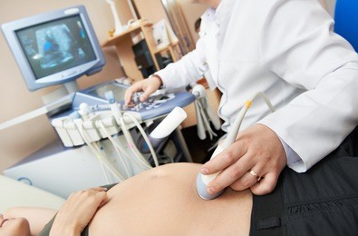 doctor with ultrasound equipment during ultrasound medical examination