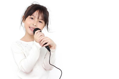 pretty little girl with the microphone in her hand