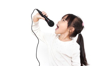 pretty little girl with the microphone in her hand