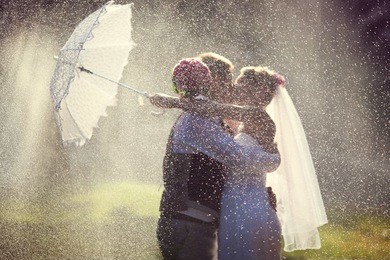 wedding kiss in the rain