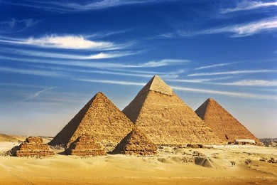 egypt. cairo - giza. general view of pyramids from the giza plateau (three pyramids known as queens' pyramids on front side; next in order from left: the pyramid of menkaure, khafre and chufu