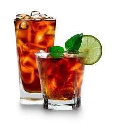 glass with cola and ice cubes over white