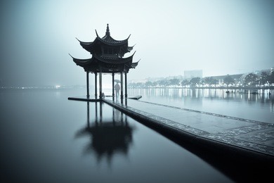 west lake of hangzhou and ancient pavilion at night