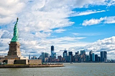the statue of liberty and manhattan skyline, new york city. usa.