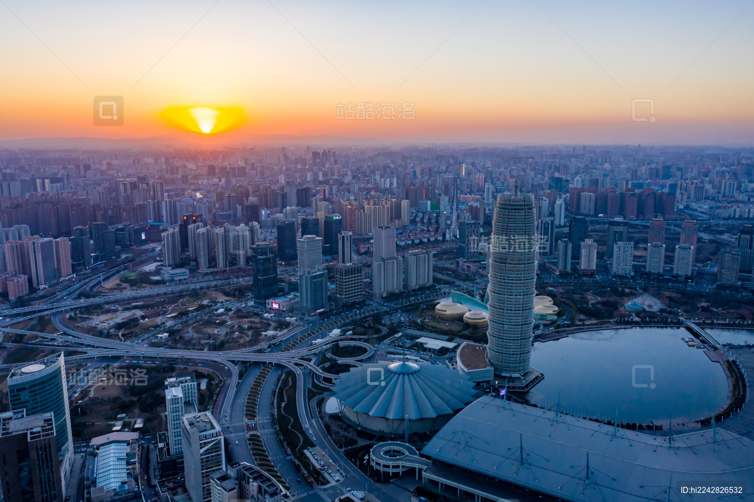 航拍郑州郑东新区CBD大玉米楼夕阳落日