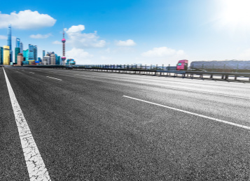 Asphalt road in front of the modern city Shanghai china