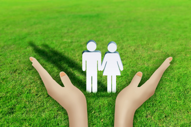 Hand holding couple on green garss