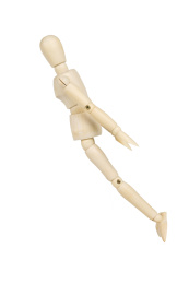Wooden model dummy in flying isolated on a white background.