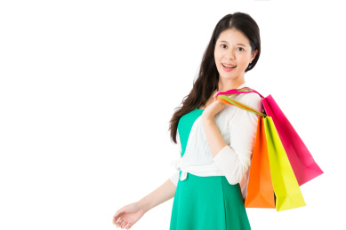 的美女模型比划购物满意在白色背景COPYSPACE感到惊喜丰富多彩袋出手。