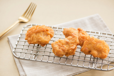 hot and crispy fried chicken legs isolated on a white background