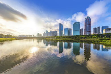 Haikou Cityscape and Skyline with Water Reflection and Sunrise in the Morning, Hainan province, China