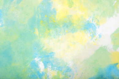 蓝色和黄色颜料在宣纸上画出来的抽象艺术底纹背景