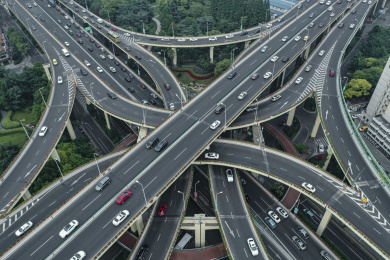aerial view of highway and overpass in city on a cloudy day