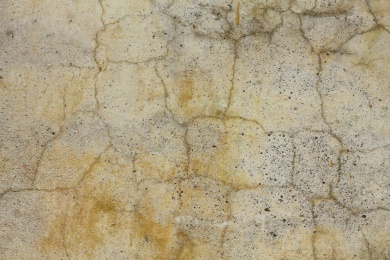 一面粗糙斑驳裂痕的白色墙面照片