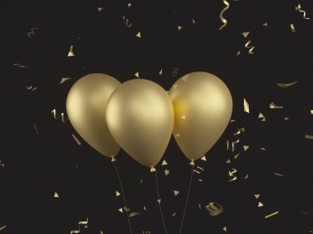 节日庆典用的金色的气球漂浮在空中