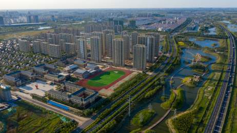 航拍山东东营市东营区绿色生态城市建筑公路风光