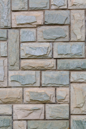 户外横竖排列的棕色石头墙材质贴图