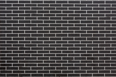 黑色砖块垒砌的墙体表面纹理
