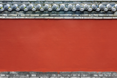灰色瓦当红色墙面的中式传统寺庙围墙背景