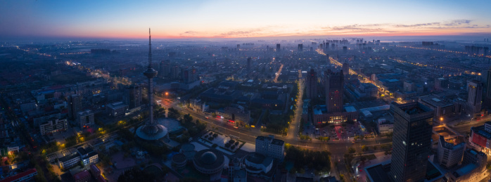 航拍山东东营胜利电视塔日出全景