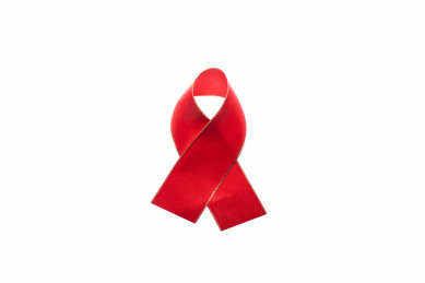 白色背景下艾滋病AIDS红丝带保护预防呵护理解概念