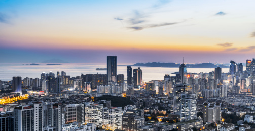 俯拍青岛现代建筑风光和夕阳日落自然景观