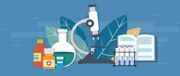 医疗显微镜前面的试管书本药瓶和烧瓶