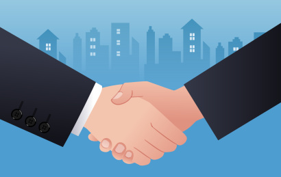 在城市剪影背景前握手