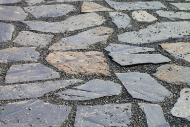irregular cobble stoned street in italian coastal town