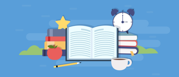 一本打开的书在书本闹钟苹果前面