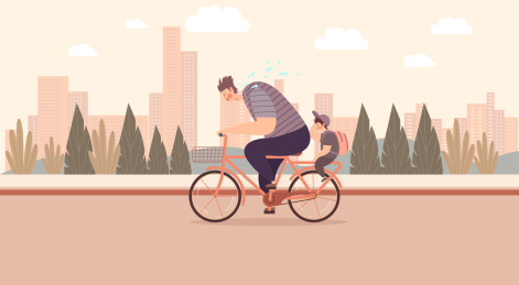 爸爸满头大汗骑着自行车载着儿子去上学