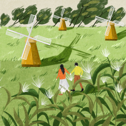 晴天在郊外散步的年轻人情侣 白色风车