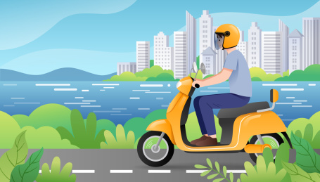 一个男生骑摩托车行驶在城市道路上