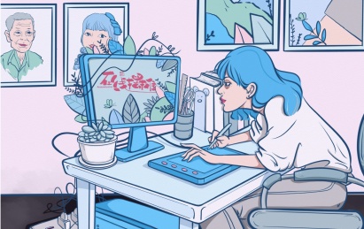 坐在电脑前画画的女孩