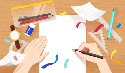 写字的手和桌面上的学习用品