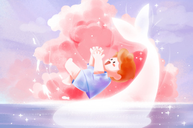在海边和鲸鱼玩耍的小男孩