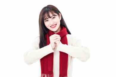 白色背景拱手拜年的年轻女性