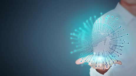 特写一个商务男人手捧发光放射的数码地球