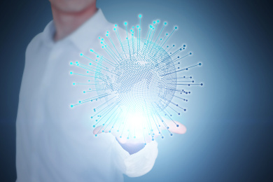 特写一个商务男人手捧发光放射的数码地球