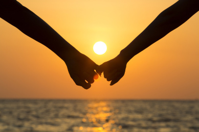 silhouettes of woman and man on a background of
